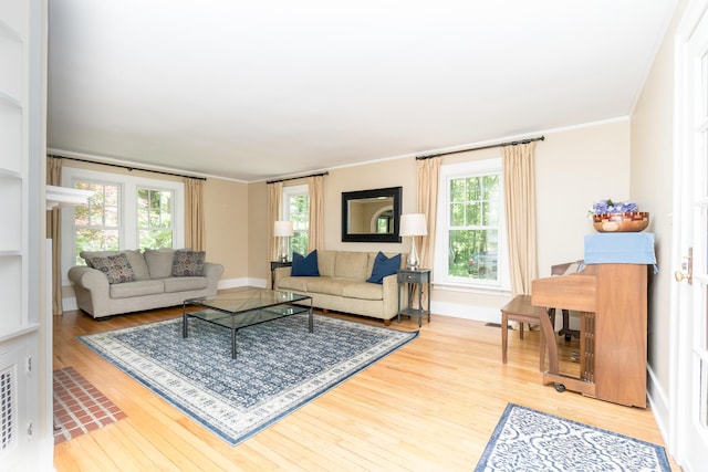 2430 Geddes Ave, Ann Arbor, MI 48104 - living room featuring wood finished floors, healthy amount of natural light, baseboards, and ornamental molding