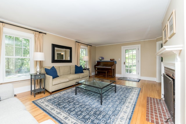2430 Geddes Ave, Ann Arbor, MI 48104 - living area featuring wood finished floors, baseboards, crown molding, and a fireplace