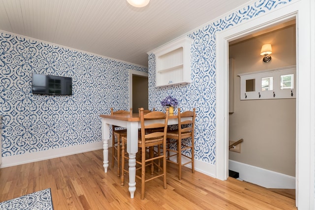 2430 Geddes Ave, Ann Arbor, MI 48104 - dining space with wallpapered walls, ornamental molding, light wood finished floors, and baseboards