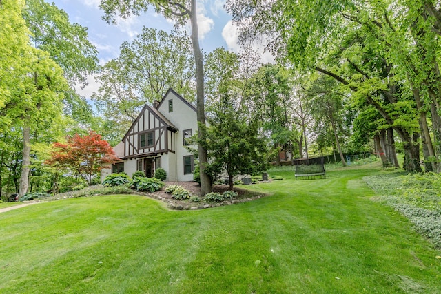 2430 Geddes Ave, Ann Arbor, MI 48104 - view of home's exterior featuring a yard and stucco siding