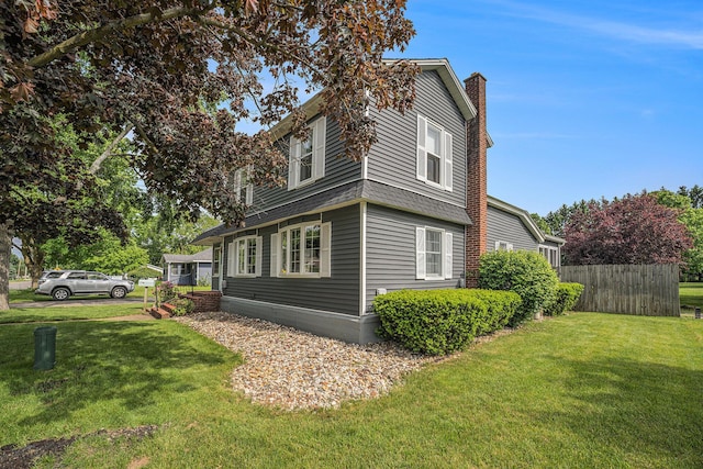 319 Washington St, Otsego, MI 49078 - view of home's exterior featuring a chimney