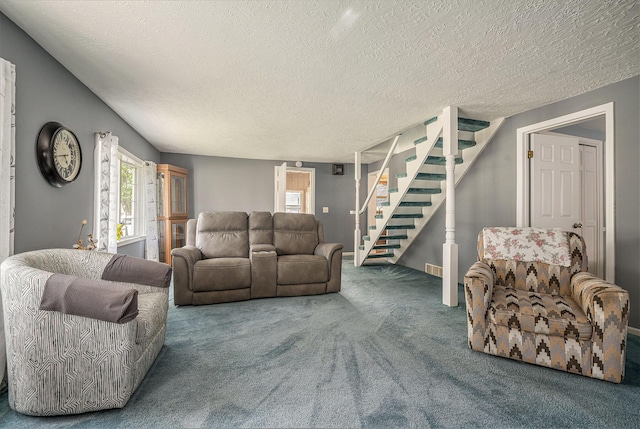 319 Washington St, Otsego, MI 49078 - carpeted living room with stairway, plenty of natural light, and a textured ceiling