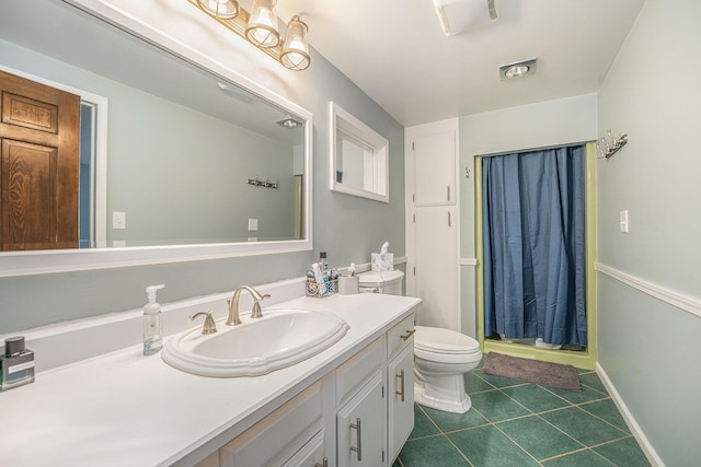 319 Washington St, Otsego, MI 49078 - bathroom with vanity, tile patterned flooring, toilet, baseboards, and a shower with shower curtain