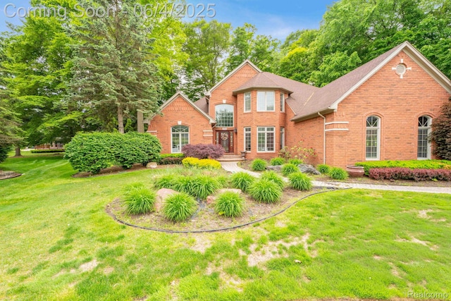 50565 Otter Creek Dr, Shelby Twp, MI 48317 - traditional home featuring brick siding and a front yard