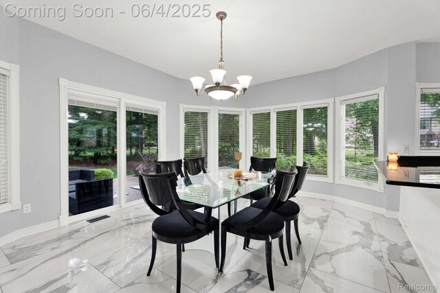 50565 Otter Creek Dr, Shelby Twp, MI 48317 - dining space with light marble finish floors, baseboards, and a chandelier