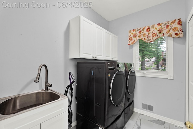 50565 Otter Creek Dr, Shelby Twp, MI 48317 - laundry area featuring washing machine and dryer, cabinet space, baseboards, and light marble finish flooring