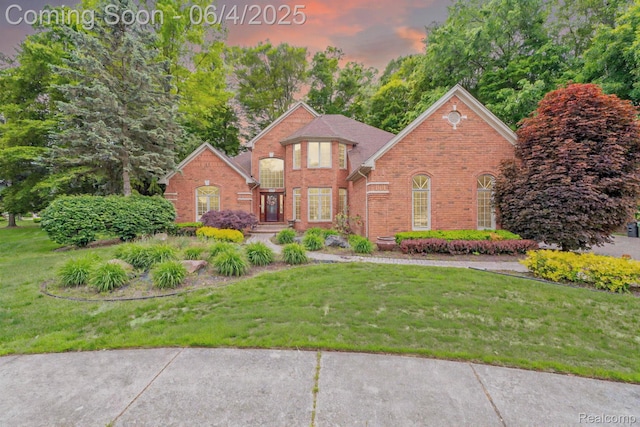 50565 Otter Creek Dr, Shelby Twp, MI 48317 - view of front of property featuring brick siding and a front yard