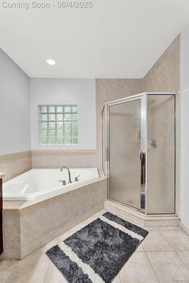 50565 Otter Creek Dr, Shelby Twp, MI 48317 - full bath featuring tile patterned floors, a garden tub, and a shower stall