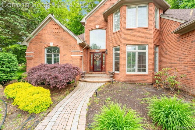 50565 Otter Creek Dr, Shelby Twp, MI 48317 - view of exterior entry with brick siding