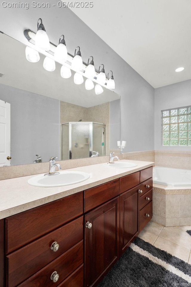 50565 Otter Creek Dr, Shelby Twp, MI 48317 - full bathroom with a shower stall, double vanity, a garden tub, and tile patterned floors