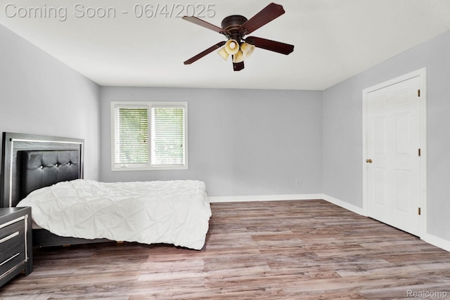 50565 Otter Creek Dr, Shelby Twp, MI 48317 - bedroom with wood finished floors, baseboards, and a ceiling fan