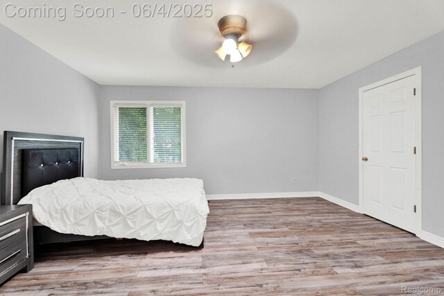 50565 Otter Creek Dr, Shelby Twp, MI 48317 - bedroom featuring wood finished floors, baseboards, and ceiling fan