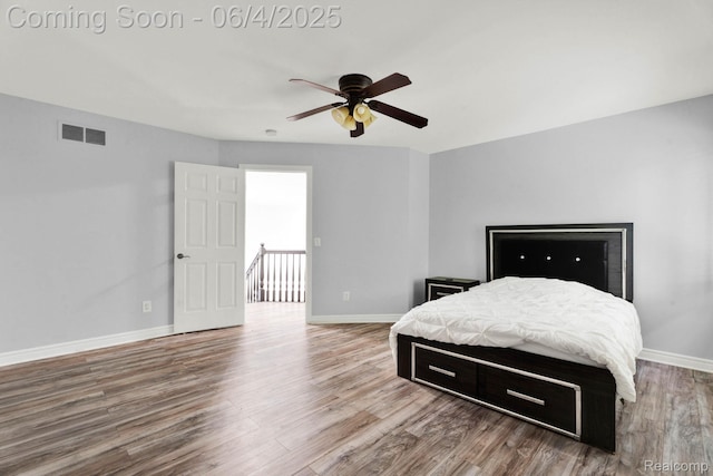 50565 Otter Creek Dr, Shelby Twp, MI 48317 - bedroom featuring wood finished floors, baseboards, and ceiling fan