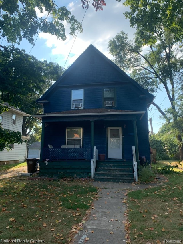 1028 Woodbridge St, Jackson, MI 49203 - view of front facade with a porch