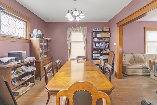 707 Glenwood Ave, Port Huron, MI 48060 - dining room with wood finished floors and a chandelier