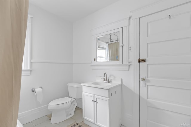707 Glenwood Ave, Port Huron, MI 48060 - bathroom with vanity, tile patterned flooring, and toilet