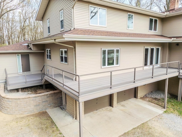175 Templar Ave, Pinckney, MI 48169 - back of property with a garage and a shingled roof