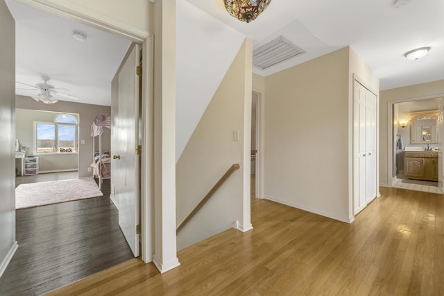 175 Templar Ave, Pinckney, MI 48169 - hallway with an upstairs landing, wood finished floors, and baseboards