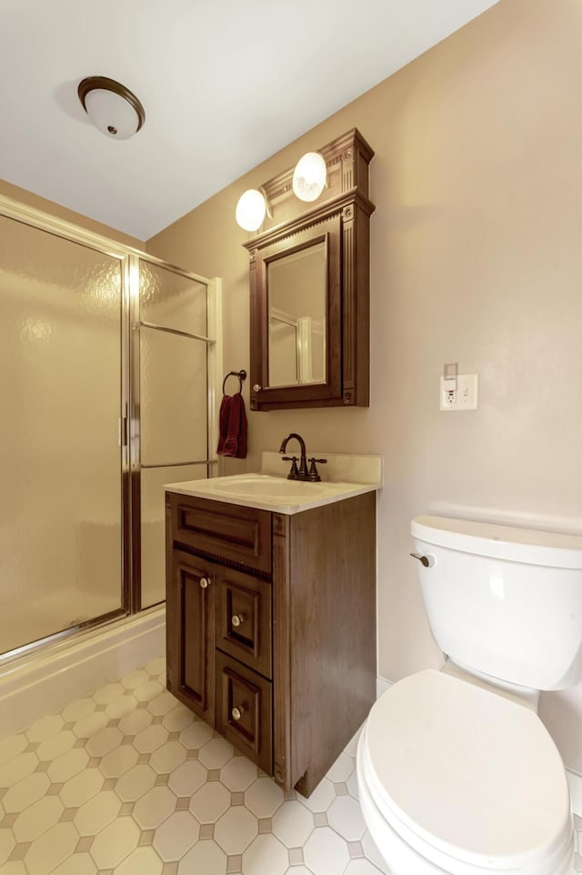 175 Templar Ave, Pinckney, MI 48169 - bathroom featuring vanity, a stall shower, toilet, and tile patterned floors