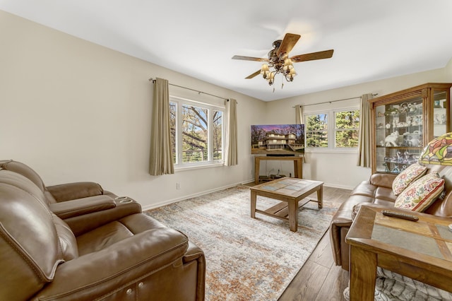 175 Templar Ave, Pinckney, MI 48169 - living room featuring wood finished floors, a ceiling fan, and baseboards