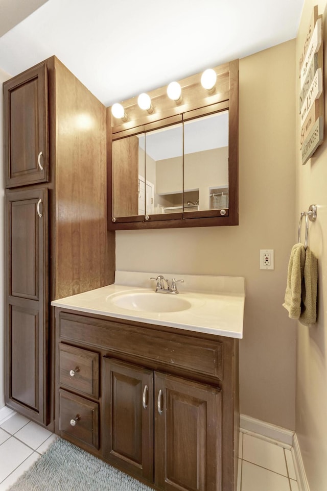 175 Templar Ave, Pinckney, MI 48169 - bathroom with tile patterned floors, vanity, and baseboards