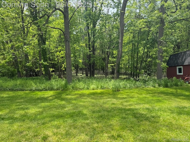 4327 Lancashire, Milford, MI 48380 - view of green lawn featuring an outbuilding