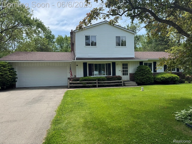 4327 Lancashire, Milford, MI 48380 - traditional home with driveway, a front lawn, a chimney, a garage, and roof with shingles