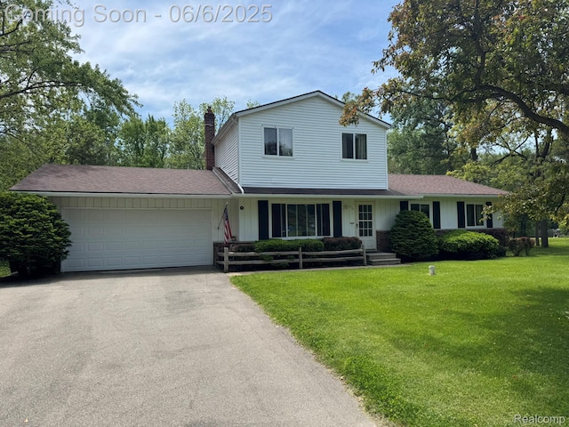 4327 Lancashire, Milford, MI 48380 - traditional-style house with a chimney, driveway, a garage, a front yard, and roof with shingles