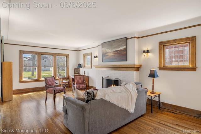 797 Washington Rd, Grosse Pointe, MI 48230 - living room with a brick fireplace, baseboards, healthy amount of natural light, and crown molding