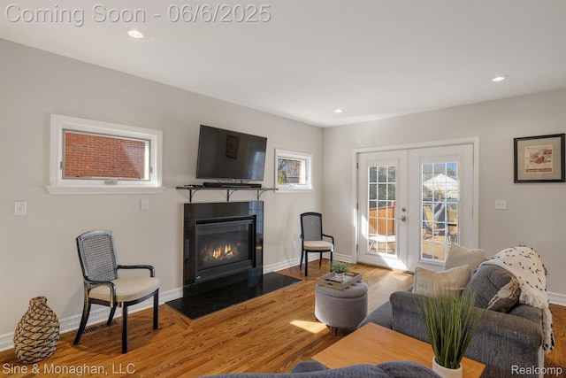 797 Washington Rd, Grosse Pointe, MI 48230 - living room with a fireplace with flush hearth, wood finished floors, french doors, baseboards, and recessed lighting