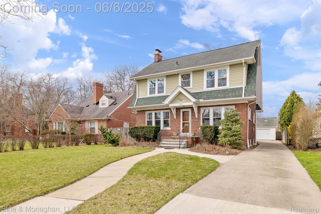 797 Washington Rd, Grosse Pointe, MI 48230 - view of front of property with a chimney, brick siding, and a detached garage