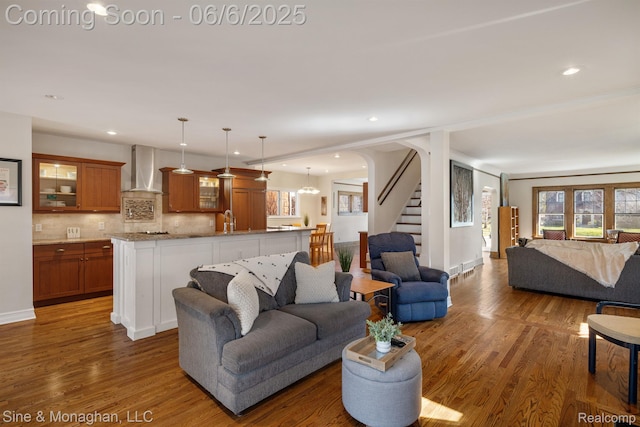 797 Washington Rd, Grosse Pointe, MI 48230 - living area with stairs, wood finished floors, recessed lighting, and baseboards