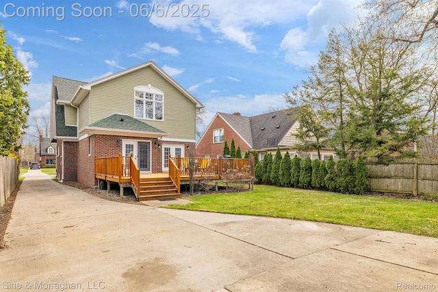 797 Washington Rd, Grosse Pointe, MI 48230 - back of property with brick siding, a wooden deck, french doors, and a shingled roof
