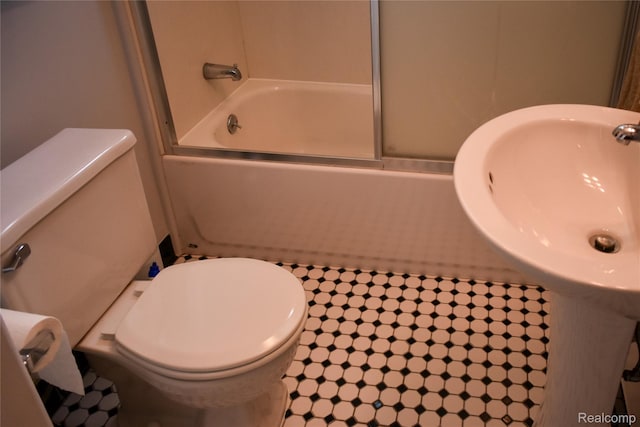 3434 Durham Rd, Clawson, MI 48073 - bathroom featuring toilet and combined bath / shower with glass door