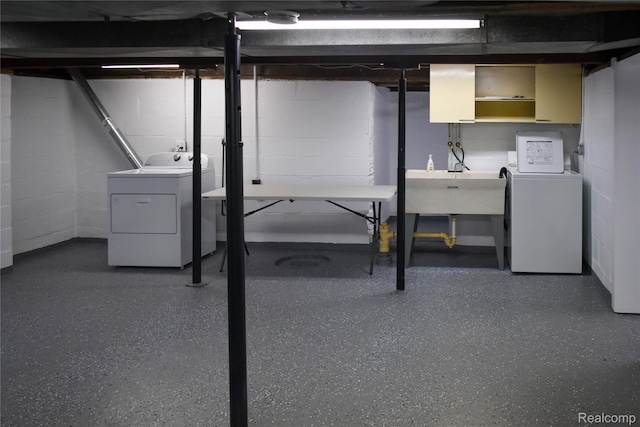 3434 Durham Rd, Clawson, MI 48073 - unfinished basement with washing machine and dryer, concrete block wall, and a sink