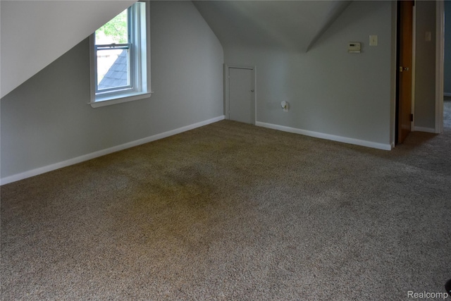 3434 Durham Rd, Clawson, MI 48073 - additional living space with vaulted ceiling, carpet flooring, and baseboards