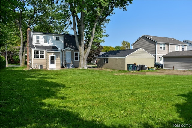 3434 Durham Rd, Clawson, MI 48073 - rear view of property with a chimney and a yard