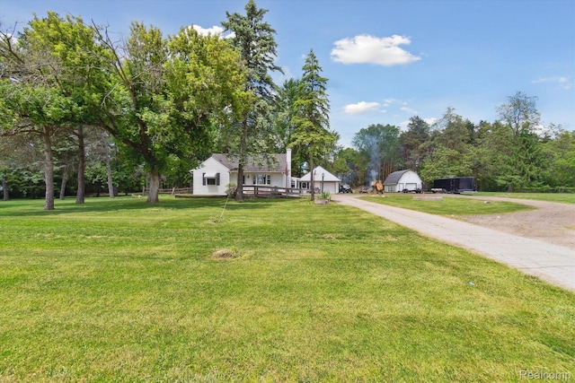 1250 W Thompson Rd, Fenton, MI 48430 - view of front of home featuring a front yard