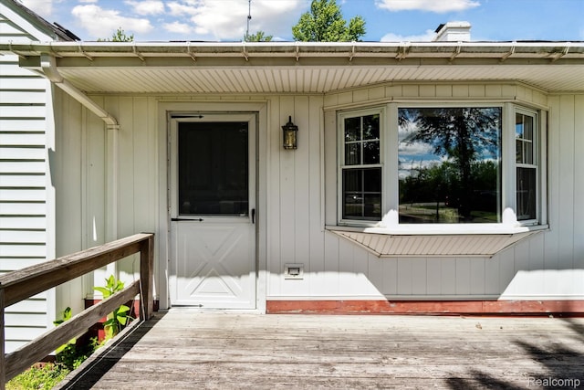 1250 W Thompson Rd, Fenton, MI 48430 - view of exterior entry with a chimney