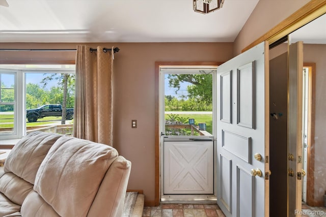1250 W Thompson Rd, Fenton, MI 48430 - doorway to outside featuring light stone finish flooring