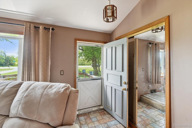 1250 W Thompson Rd, Fenton, MI 48430 - foyer featuring stone finish flooring and lofted ceiling