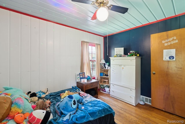 1250 W Thompson Rd, Fenton, MI 48430 - bedroom with wood finished floors and a ceiling fan