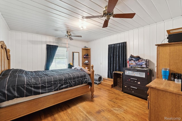 1250 W Thompson Rd, Fenton, MI 48430 - bedroom featuring light wood-type flooring, a ceiling fan, and wooden ceiling