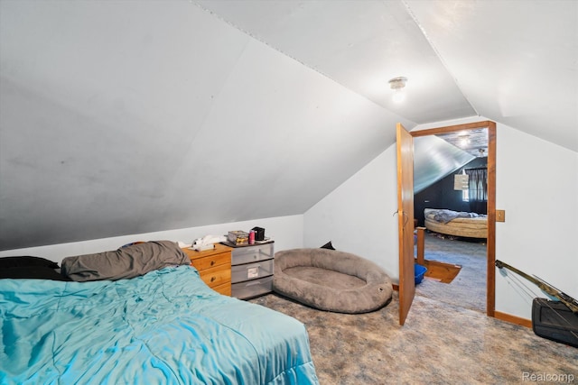 1250 W Thompson Rd, Fenton, MI 48430 - bedroom featuring vaulted ceiling and carpet floors