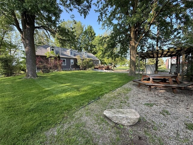 4131 Wellman Line Rd, Brown City, MI 48416 - view of grassy yard with a pergola