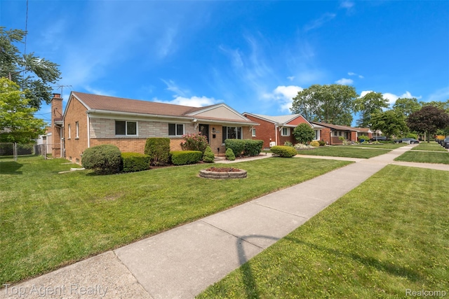 32532 Steinhauer St, Westland, MI 48186 - ranch-style house with a front yard, a chimney, and brick siding
