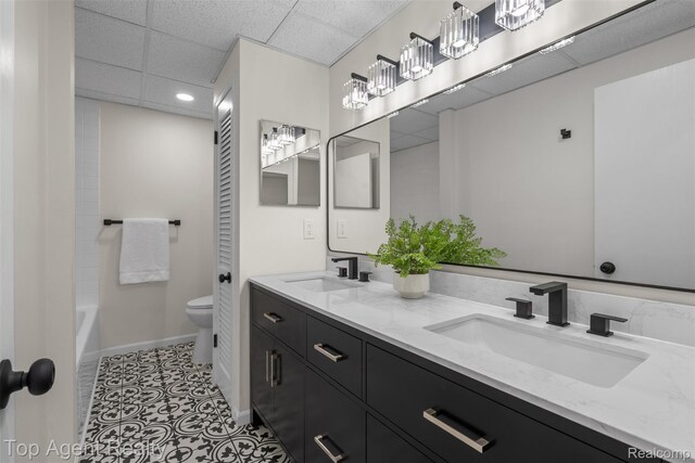 32532 Steinhauer St, Westland, MI 48186 - bathroom featuring double vanity, toilet, a paneled ceiling, recessed lighting, and tile patterned floors