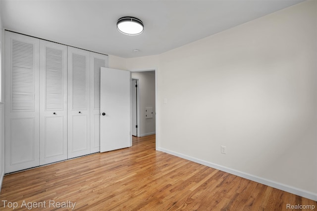 32532 Steinhauer St, Westland, MI 48186 - unfurnished bedroom featuring light wood finished floors, baseboards, and a closet
