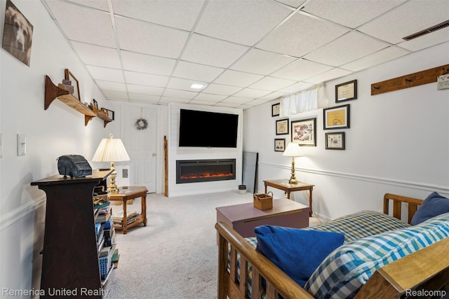3875 Zimmer Rd, Williamston, MI 48895 - carpeted living room with a drop ceiling and a glass covered fireplace