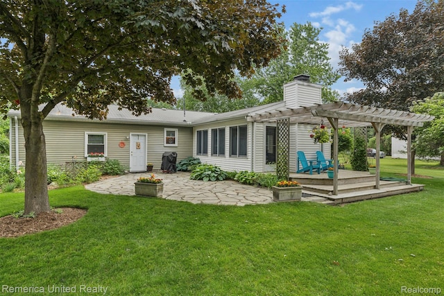 3875 Zimmer Rd, Williamston, MI 48895 - back of house with a pergola, a chimney, a yard, a wooden deck, and a patio